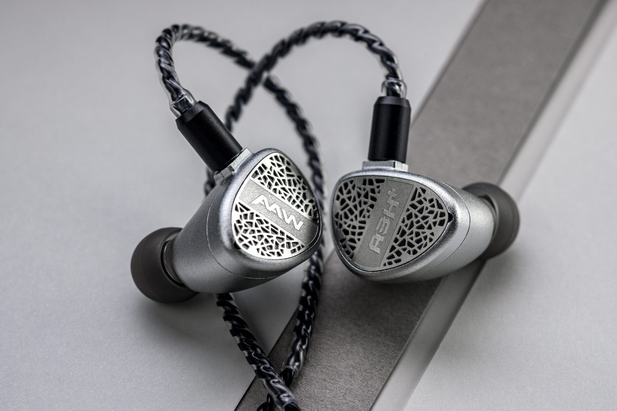 A3H+ Lux faceplate close-up showing grille pattern and cable loops