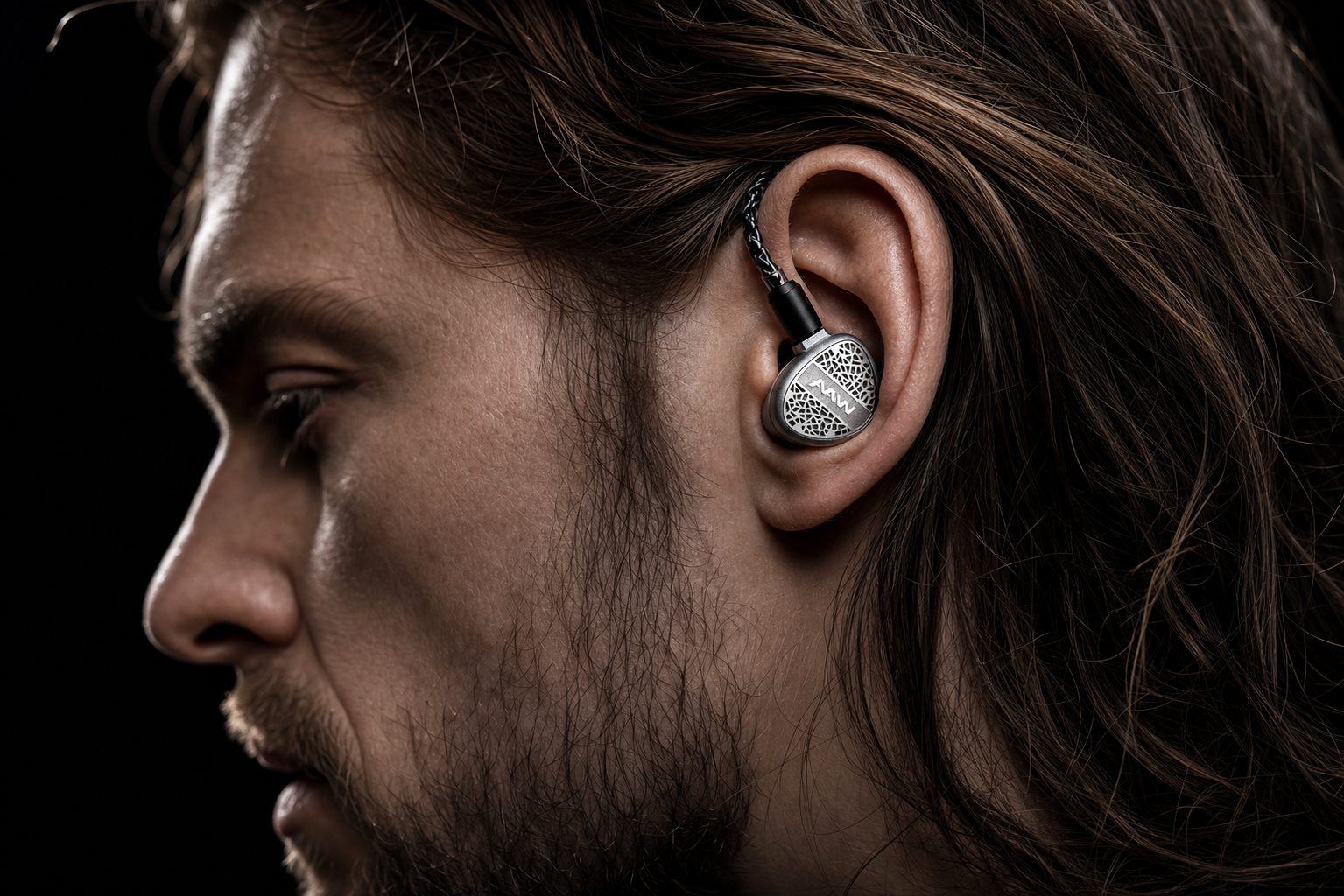A3H+ Lux universal in-ear monitor worn by a musician with over-ear cable fit