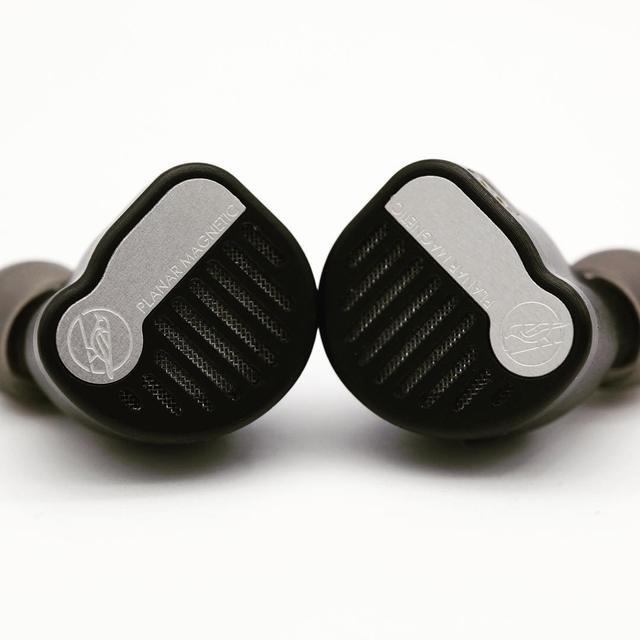 AAW planar magnetic in-ear monitor and cable on a light background