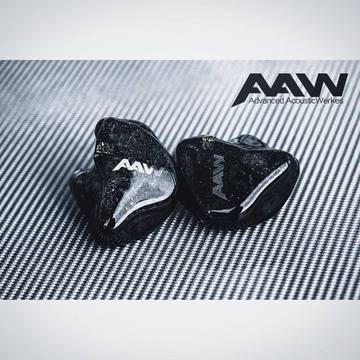 Early AAW custom in-ear monitor with dark shell and AAW logo