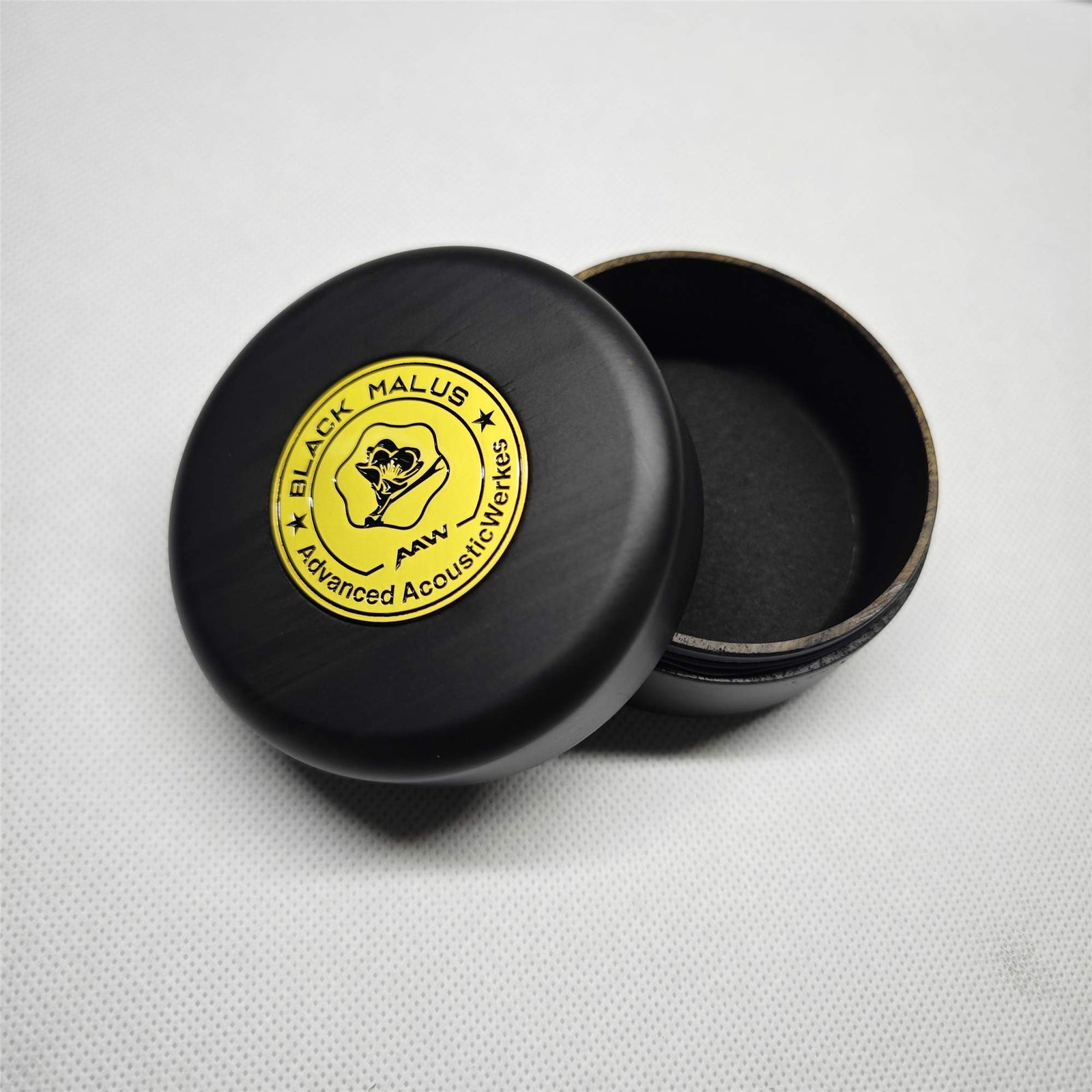 Black Malus wooden protection case with yellow badge