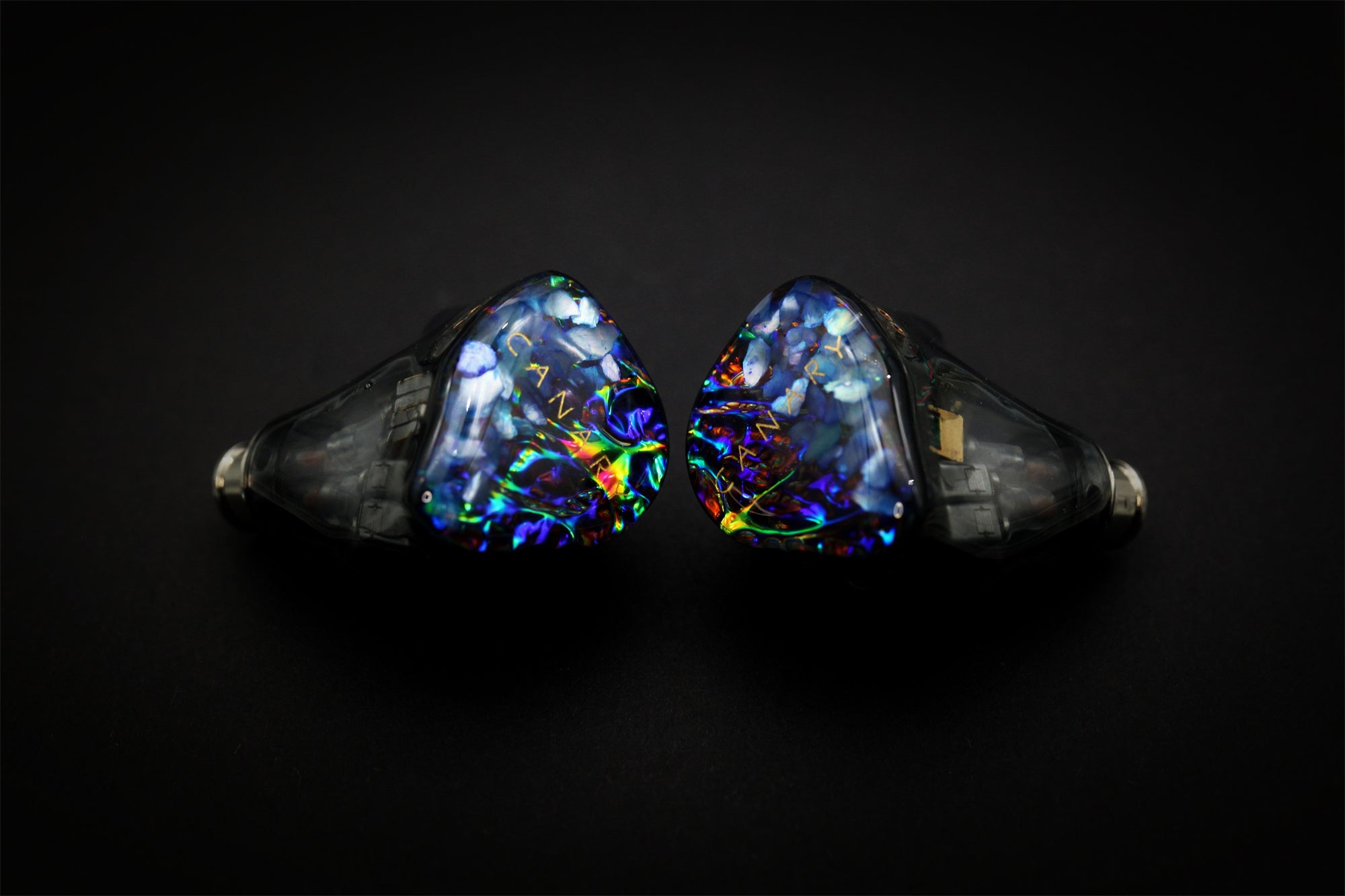 Canary Pro pair photographed front-on with blue iridescent faceplates