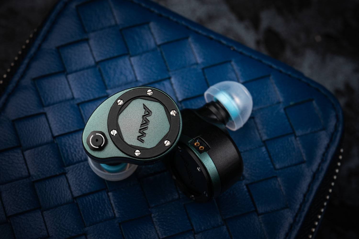 Halcyon in-ear monitors on a blue AAW carrying case