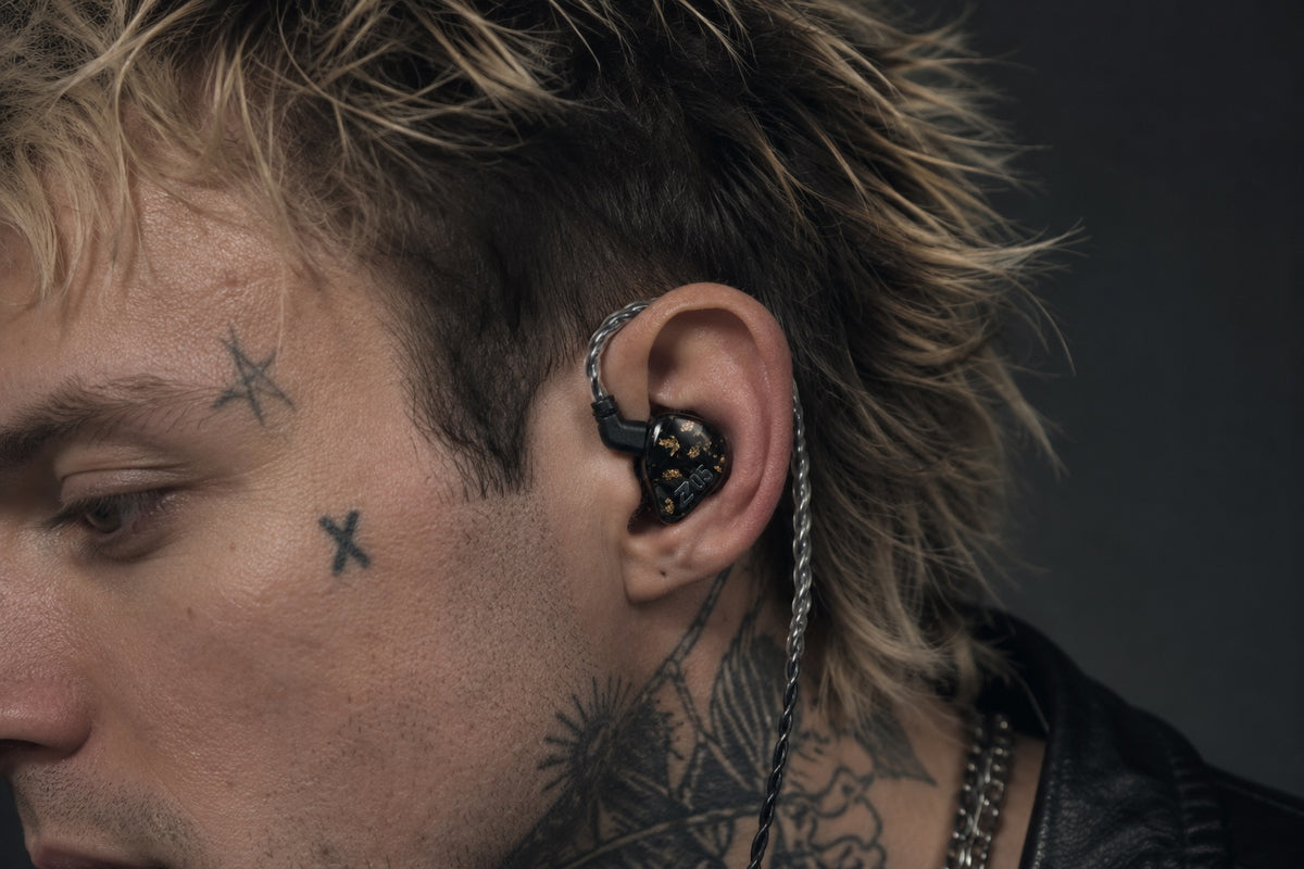 Adult male wearing Z05 AuAg universal in-ear monitor with over-ear cable